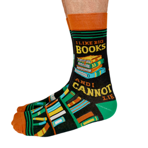 Pair of men's crew socks in orange, green, and black with a bookshelf design and the phrase 'I Like Big Books and I Cannot Lie' displayed on the side.