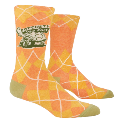 Blue Q socks featuring the bold phrase "Crotchety Old Fuck," with a humorous design for those who embrace their grumpy side.