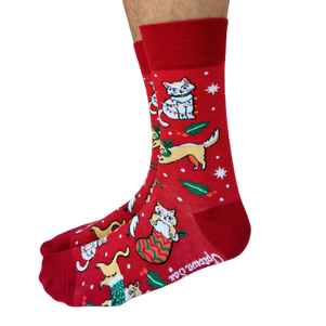 Red festive socks featuring playful holiday-themed cats, gifts, and holly designs