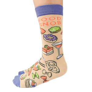 Food Snob Women's Crew Socks. Pilates? Thought you said pie and lattes! ──────────────── Size Women's shoe size 6-9 Men’s shoe size 4-7 EUR 37-41 ──────────────── Materials & Attributes 70% Combed Cotton, 28% Nylon and 2% Spandex. Reinforced stitching on toe to protect from wear. Print on Socks: "Food Snob" ──────────────── Care Machine wash and hang to dry. Do not iron or bleach.