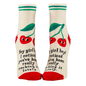 Blue Q ankle socks featuring the message "Hey Girl Hey! I Noticed You’ve Been Really Rocking It Lately," designed to spread positivity and celebrate hard work.