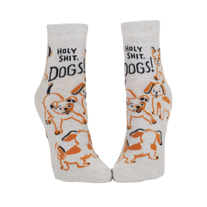 Cream ankle socks printed with the phrase ‘Holy Shit. Dogs!’ and multiple illustrated dog faces.