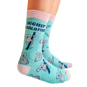 Highly Koalafied, teal background and pink toes and heal. Koala pattern all over the socks with print on socks "Highly Koalafied"
