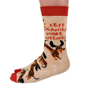 Meanie Weenie Socks by Uptown Sox featuring a playful, cheeky design with a hot dog and bold text, perfect for fun-loving and quirky sock enthusiasts.