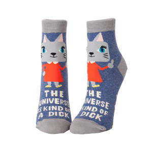 crew socks featuring the phrase “The Universe Is Kind Of A Dick” in bold lettering, designed by BlueQ.