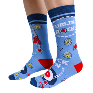 Curling Rocks (For Her) - Sock Bar. Blue Background with curler pushing rock to the end on the socks. Buy online Women's Novelty Socks.